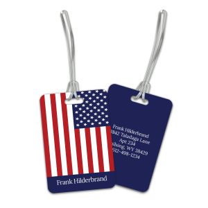 Front and back views of a custom luggage tag showcasing a red and white American flag graphic on one side and a solid navy personalized back.