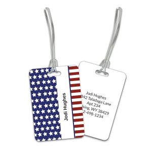 Front and back view of a Stars and Stripes plastic luggage tag with plastic strap, displaying American flag design and contact text.