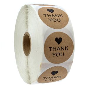 A large roll of circular brown kraft stickers showcasing a simple black heart icon above the printed words 