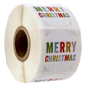 Roll of round stickers reading Merry Christmas in colorful stamped block lettering, showing the front sticker and roll thickness.