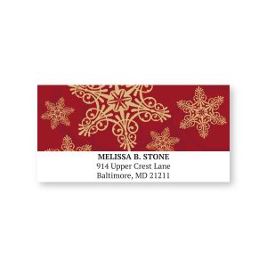 Regal Snowflakes personalized address label featuring ornate gold snowflakes on a deep red background above customized return address text.