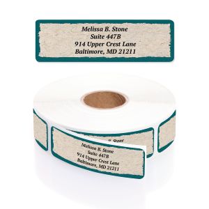 A rectangular personalized address label displayed above a large roll of matching labels, featuring a textured parchment design and dark green borders.