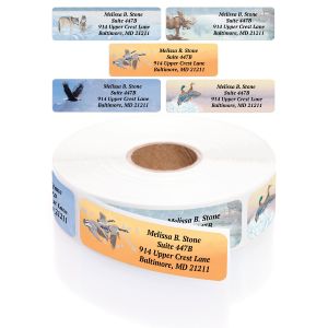 A rectangular personalized address label displayed above a large roll of matching labels, showcasing five assorted wildlife and nature scenes.
