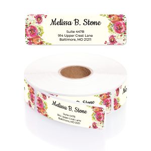 A large roll of ivory address labels featuring a vibrant pink and orange watercolor floral border alongside elegant script typography.