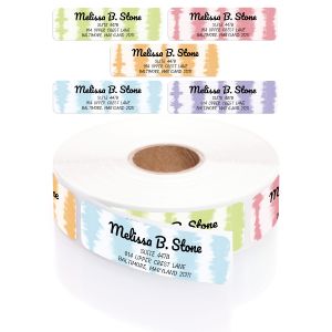 A rectangular personalized address label displayed above a large roll of matching labels, featuring a vibrant, multi-colored tie-dye border.
