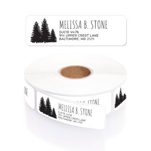 A close-up of a white rolled address label featuring a detailed black pine forest silhouette on the left and modern, clean black text.
