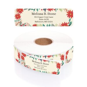 Single personalized address label with holiday floral illustrations displayed above a rolled coil of printed return address stickers.