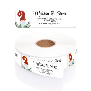 Roll of personalized Holiday Gnome address labels featuring a gnome with a red Santa hat and festive evergreen greenery.