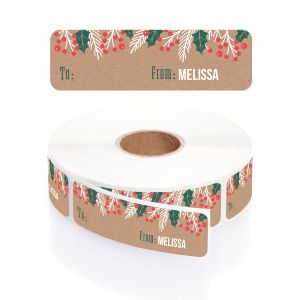 A paper roll of kraft holiday address labels featuring a festive green holly and red berry border design with a clean layout template.
