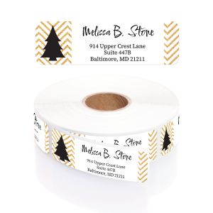 Close-up view of a roll of personalized Black and Gold Holiday tree address labels featuring faux gold chevrons and custom text.