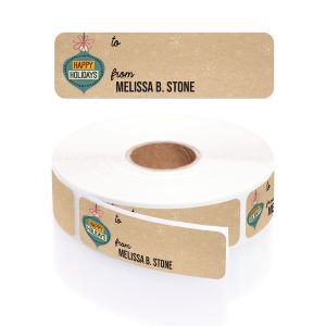 A paper roll of faux kraft holiday gift tags featuring a retro blue ornament illustration, white snowflakes, and a crisp To/From layout.