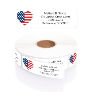A roll of personalized white address labels featuring a bold red, white, and blue American flag heart graphic next to clear typography.