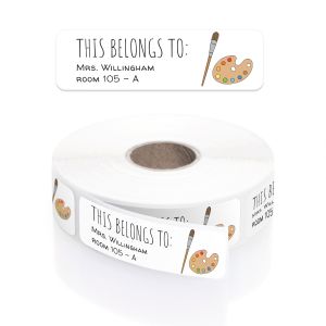 A roll of personalized classroom name labels with an art paintbrush and palette design, in a clear plastic dispenser with a close-up overlay.