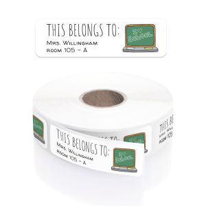 A roll of personalized classroom name labels with a chalkboard laptop design, in a clear plastic dispenser with a close-up graphic overlay.