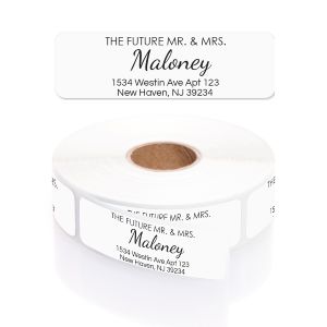 Roll of white personalized wedding address labels featuring elegant cursive script reading The Future Mr. and Mrs. Maloney on top.