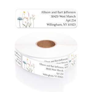 A large roll of white address labels featuring an elegant watercolor wildflower illustration and clean black typography layout.