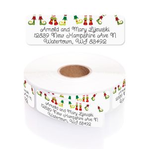 Whimsical elf shoes holiday address label shown above a roll of personalized return address labels featuring festive sock and shoe icons.