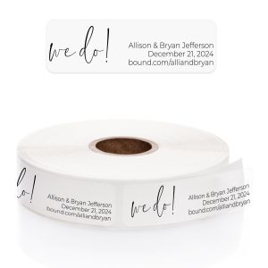 A transparent rectangular address label displayed above a roll of matching clear labels, featuring the romantic cursive phrase 