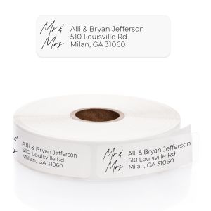 A large roll of clear, transparent address labels featuring an elegant cursive font for the name lines and crisp block text for the address.