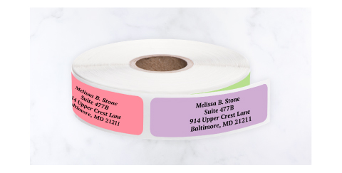Standalone rolls of Current Labels address labels in various colors and metallic finishes.